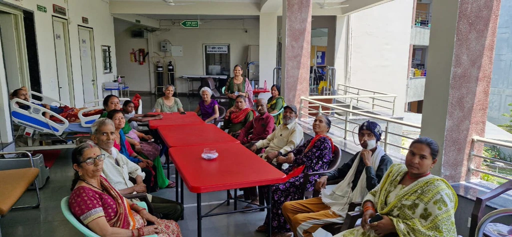 Care team and patients inside the Ganga Prem Hospice inpatient facility